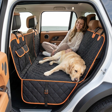 Owner relaxing with dog on the DenHound hammock