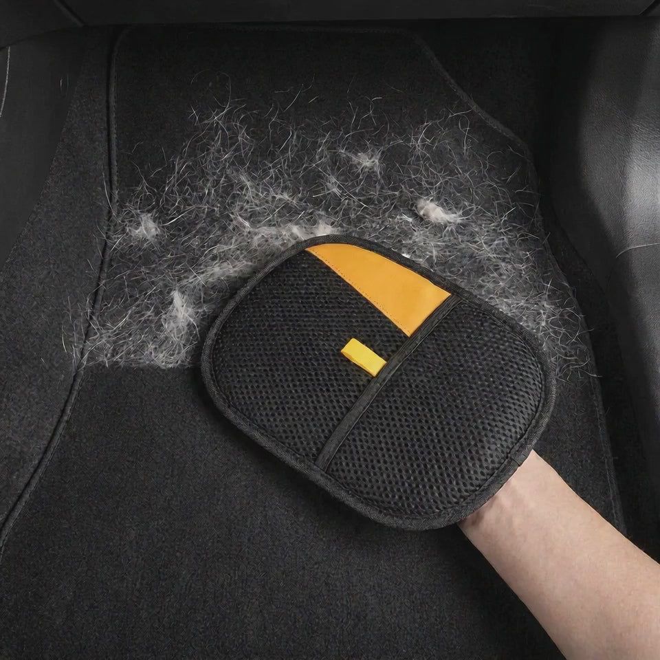 DenHound glove cleaning pet hair off a car floor mat